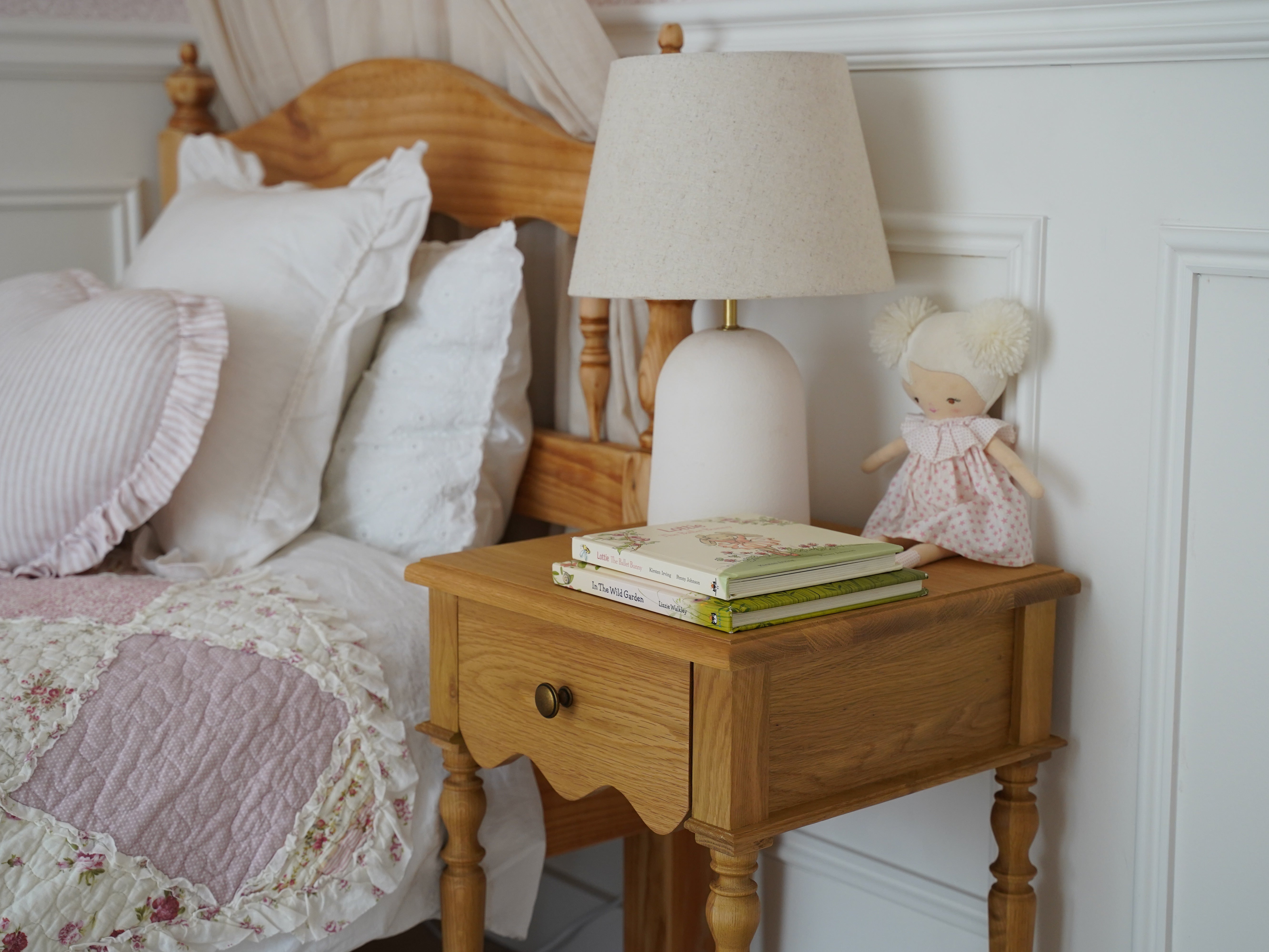 The Evie bedside in oak in a little girl's room