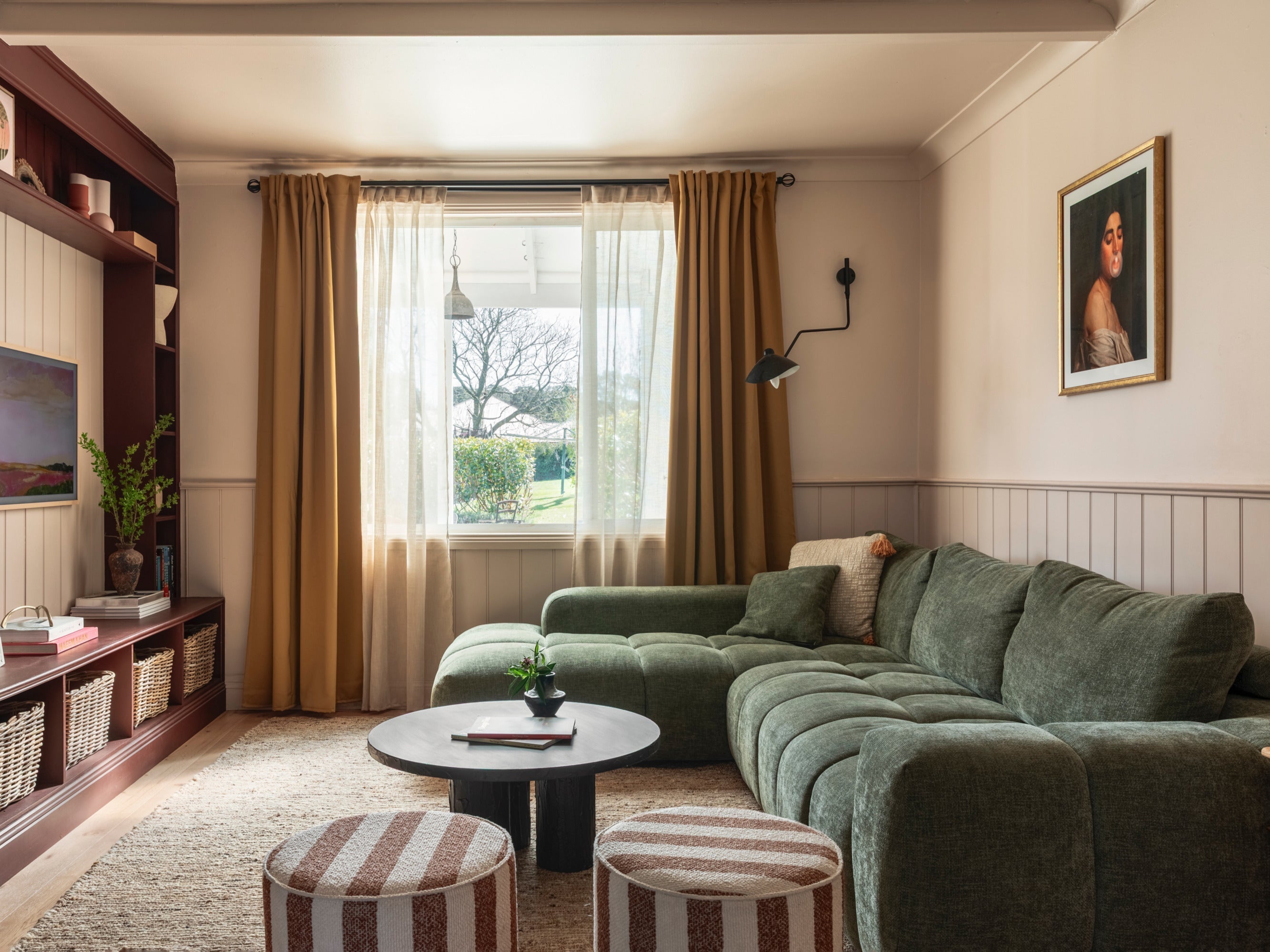 A warm loungeroom decorated in olive green and chocolate brown pin stripe as styled by opal and oak