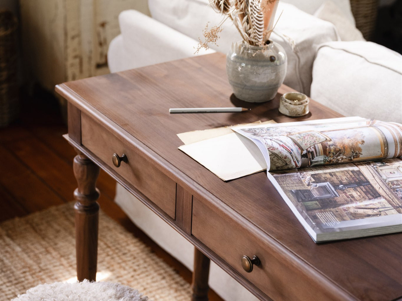 The Chloe Console next to a sofa bed in a living room